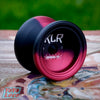 General Yo KLR YoYo, 7075 alloy edition, Black/Red Splash on a mosaic tile park bench